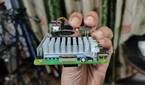 An image of the Raspberry Pi 5 with the power button and PCIe interface visible