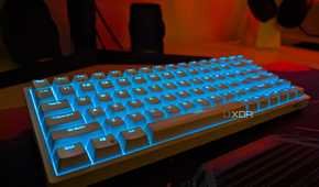 RK84 white keyboard with blue backlight on a desk