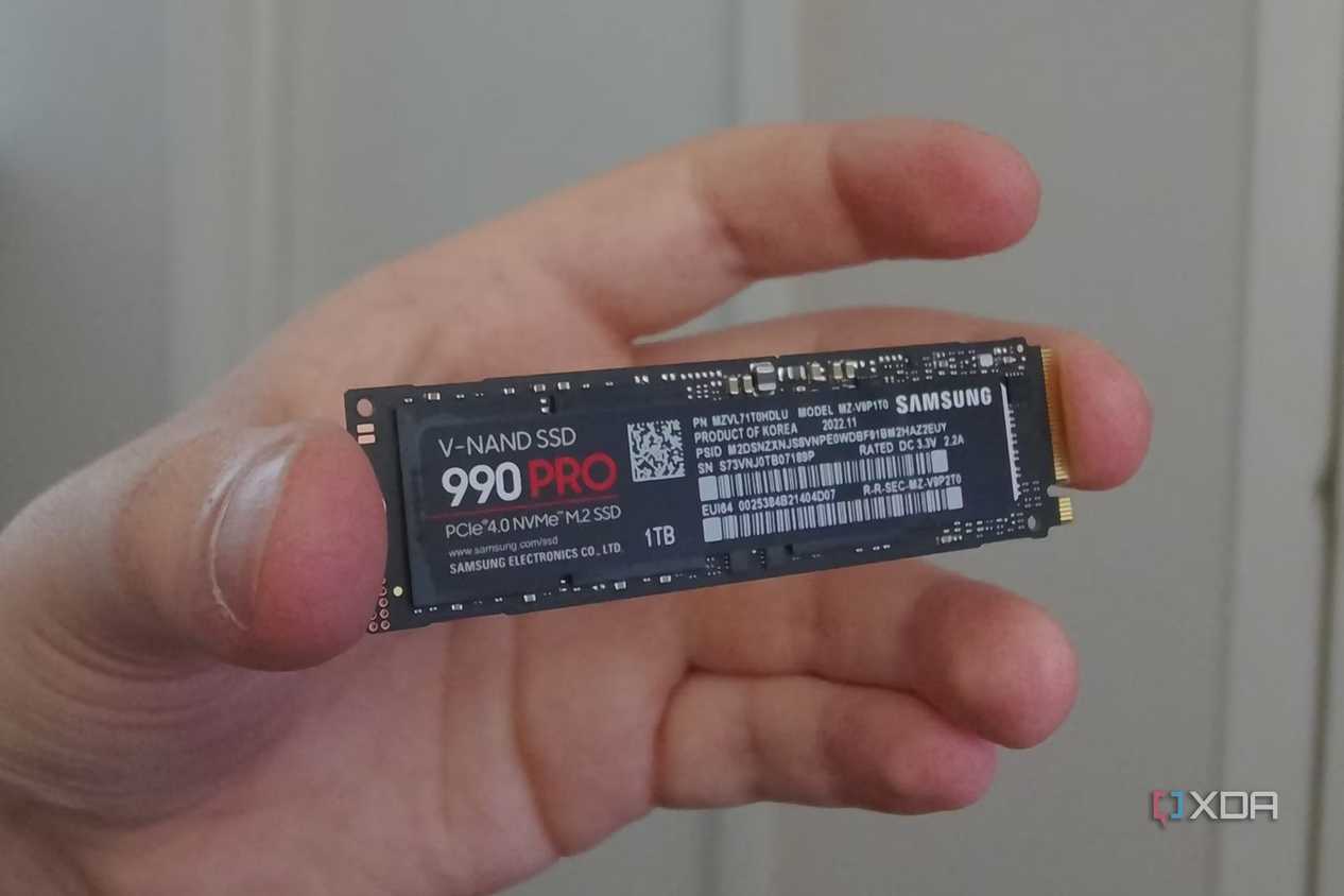 An image showing a person holding Samsung 990 Pro SSD.