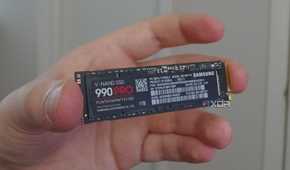 An image showing a person holding Samsung 990 Pro SSD.