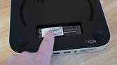 Holding down the SSD with a finger.