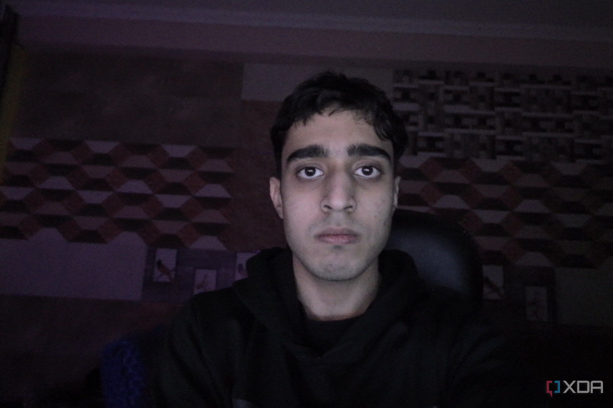 An image of a man sitting in front of the OBSBOT Tail Air webcam