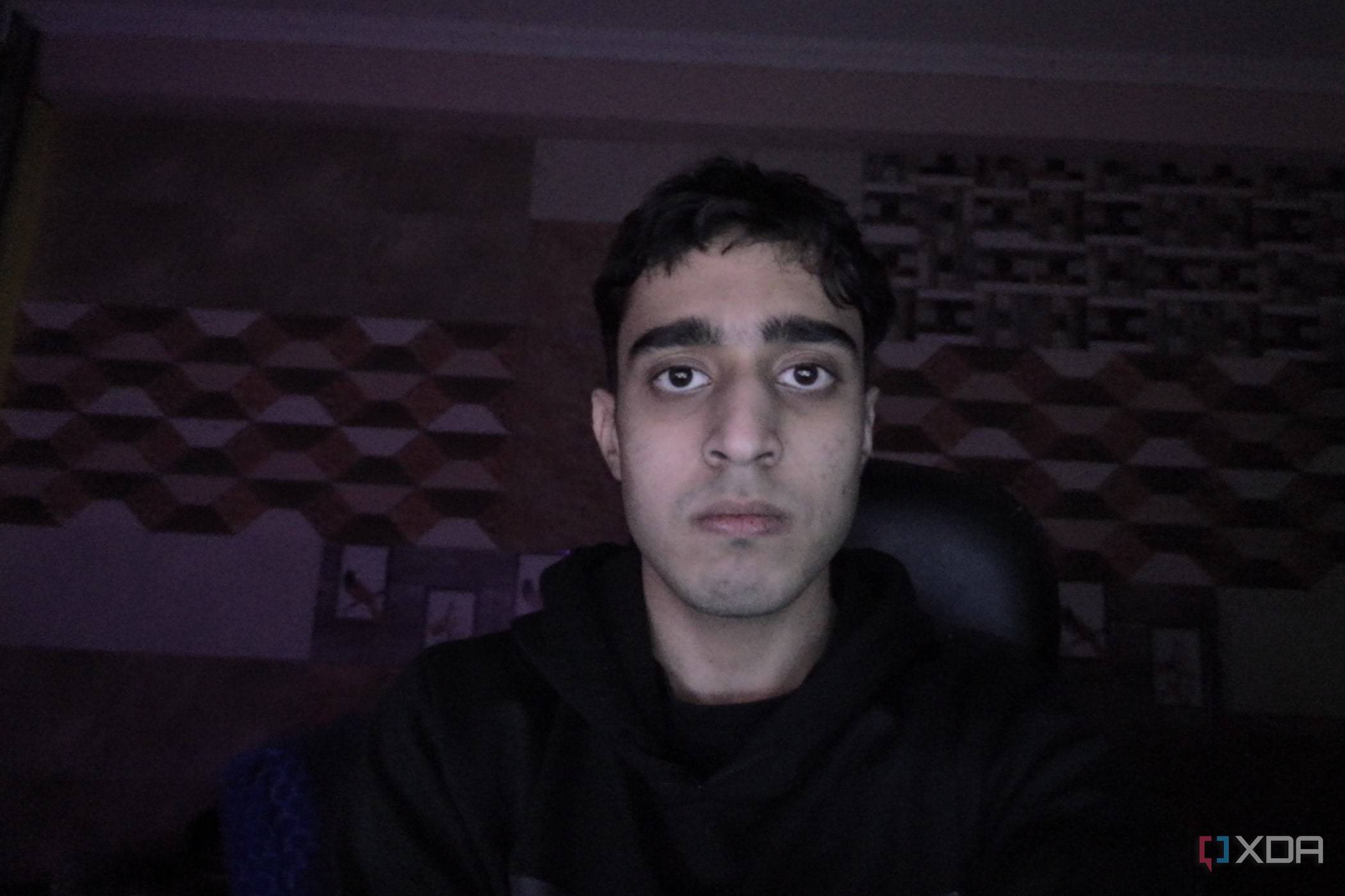 An image of a man sitting in front of the OBSBOT Tail Air webcam