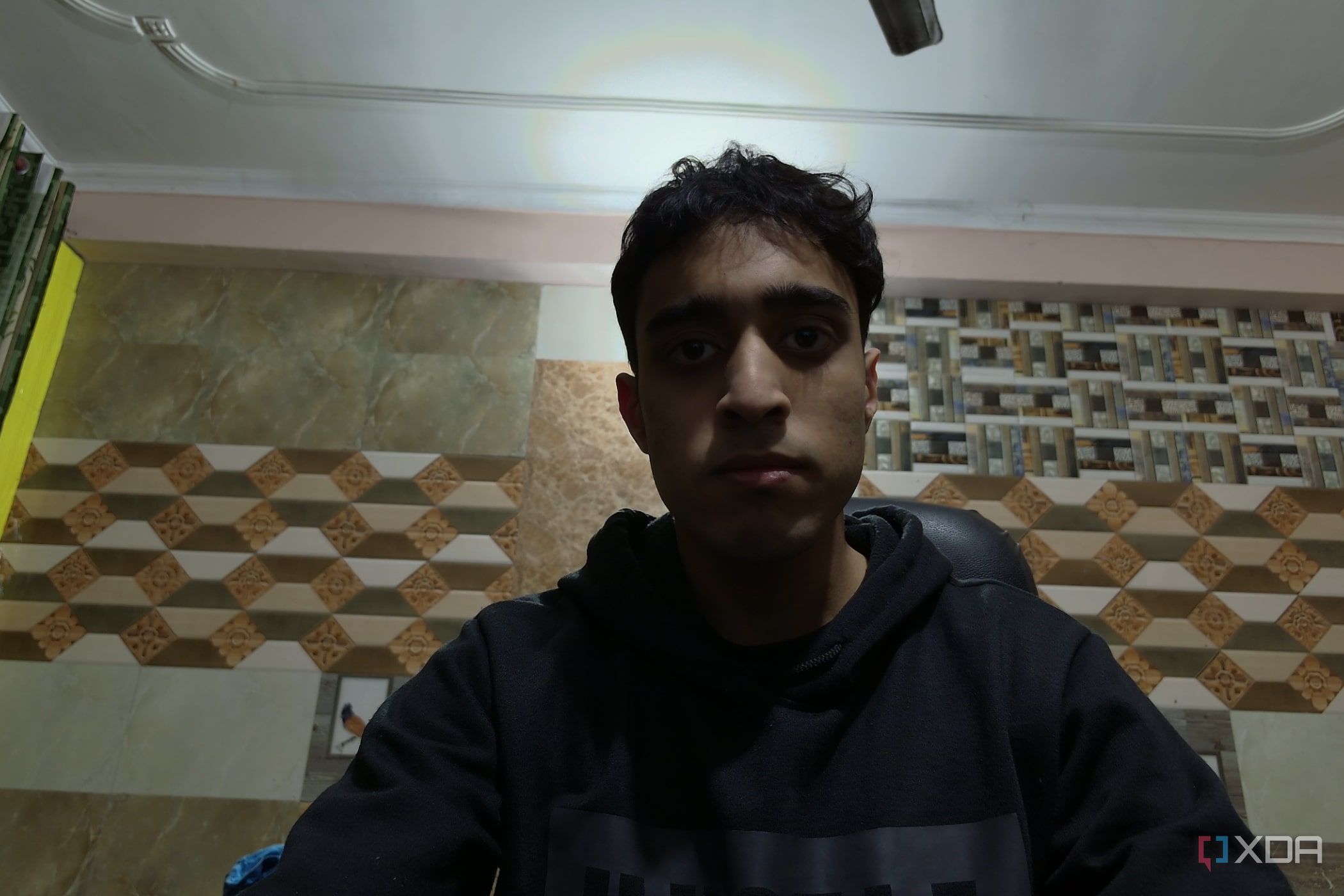 An image of a man sitting in front of the OBSBOT Tail Air webcam