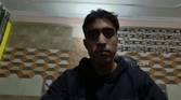 An image of a man sitting in front of the OBSBOT Tail Air webcam