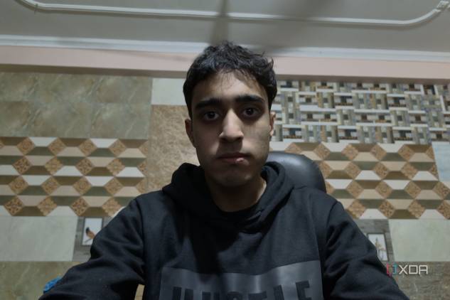 An image of a man sitting in front of the OBSBOT Tail Air webcam