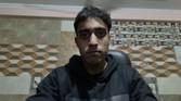 An image of a man sitting in front of the OBSBOT Tail Air webcam