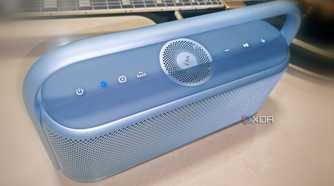 Soundcore Motion X600 in Lunar Blue with Black Les Paul guitar in background