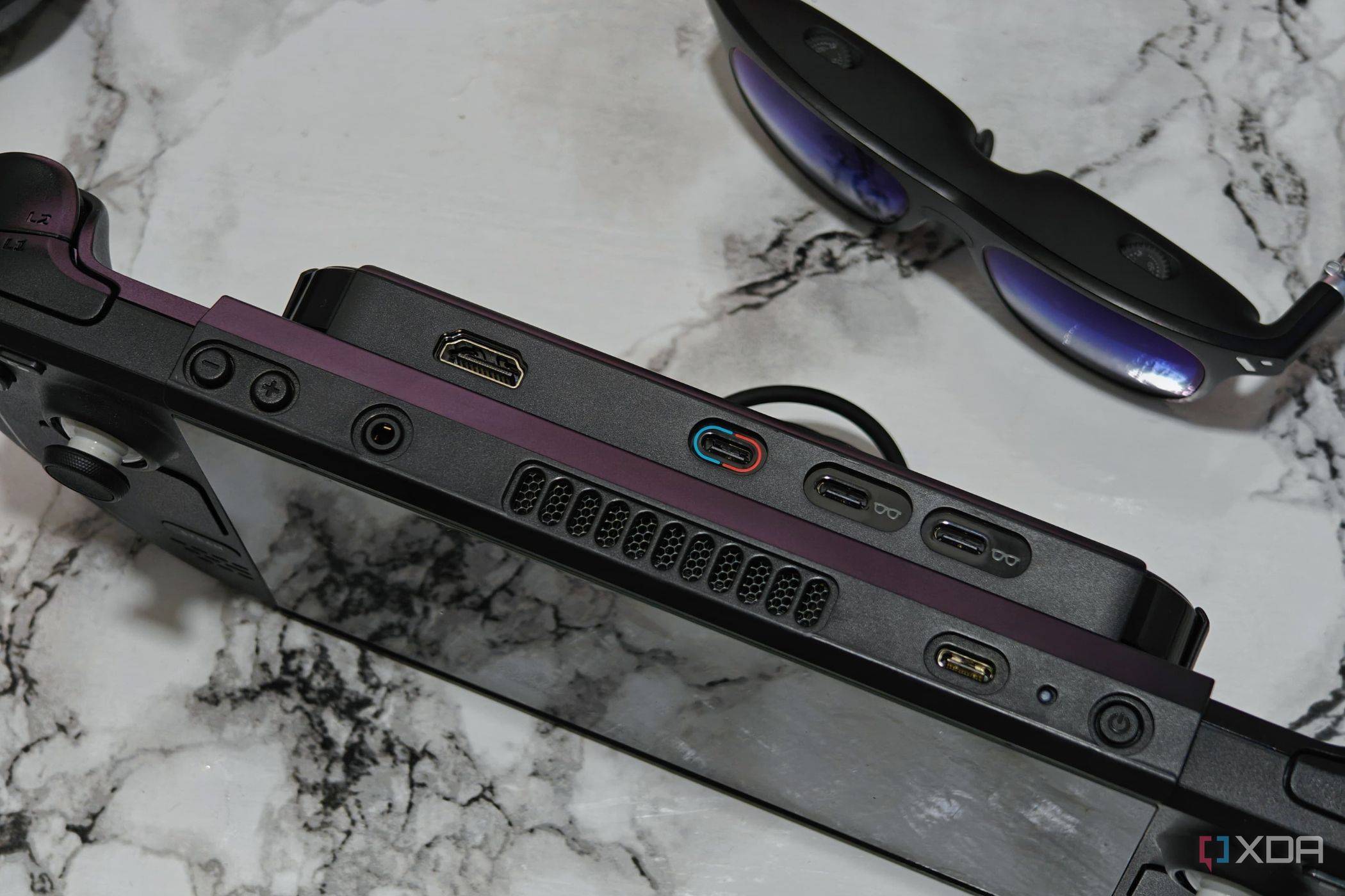An image showing the Steam Deck placed next to Viture One smart glasses.