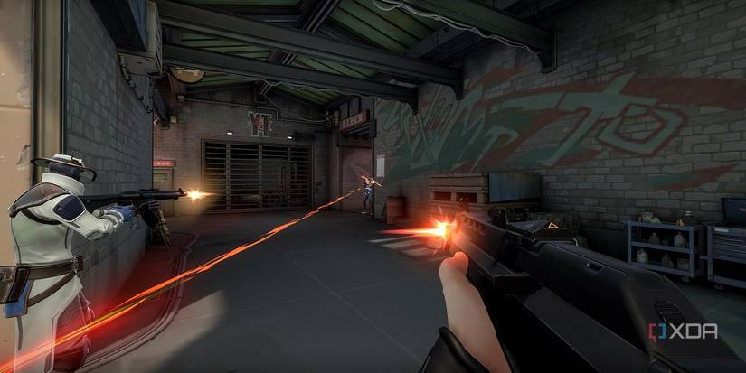 A screenshot of Valorant gameplay, showing three characters shooting at each other