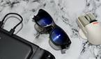 An image showing the Viture One glasses kept next to ta mouse and Steam Deck.