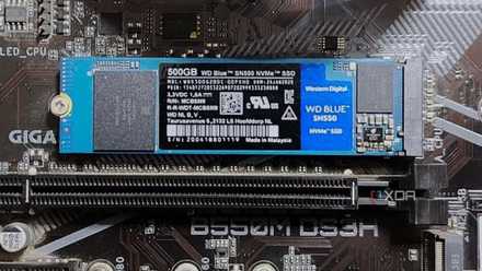 I purchased a 12,000MB/s SSD for gaming and discovered a dear lesson about bottlenecks An image showing the WD Blue SN550 M.2 SSD installed on a motherboard.