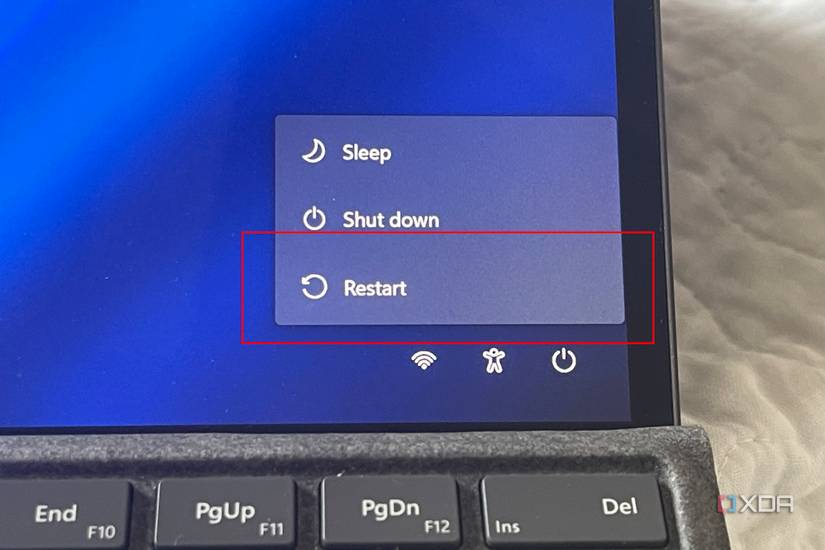 A photo of the restart button in Windows 11 showing the restart button