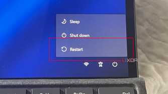 A photo of the restart button in Windows 11 showing the restart button