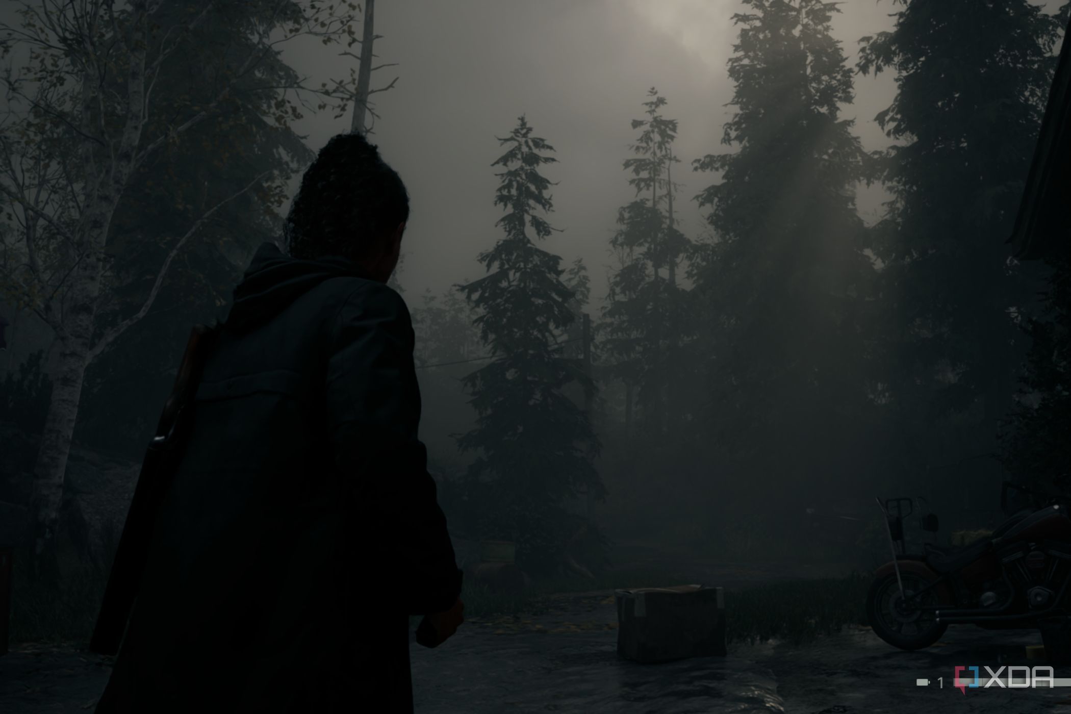 A screenshot showing a scene in Alan Wake 2 showing volumetric lighting and fog.