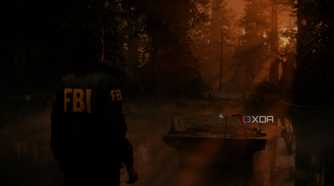 A screenshto showing sunrays peeking through tress in a forest in Alan Wake 2.