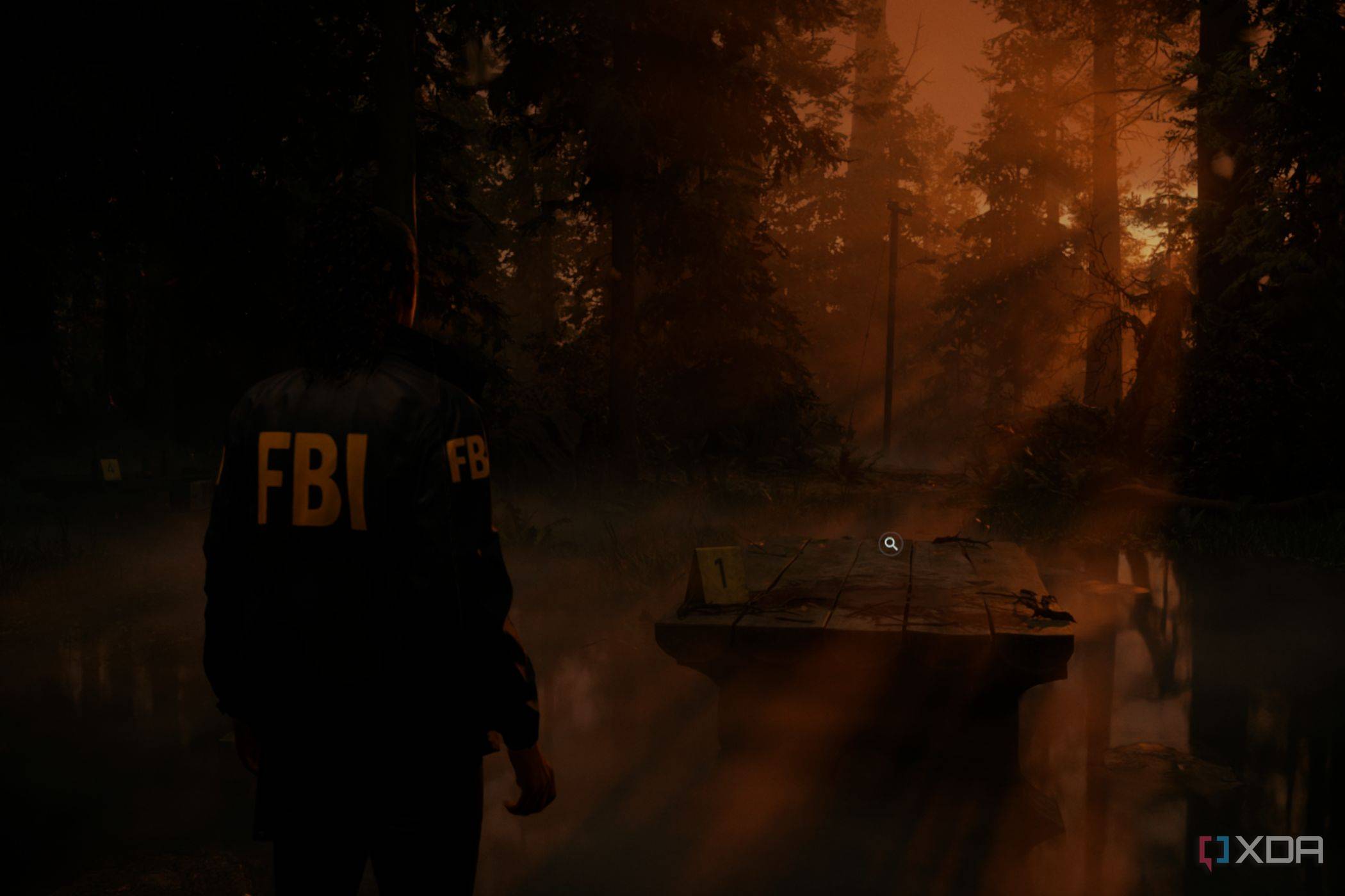 A screenshto showing sunrays peeking through tress in a forest in Alan Wake 2.