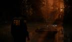 A screenshto showing sunrays peeking through tress in a forest in Alan Wake 2.