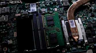 A close up image of a motherboard with a CPU heatsink extending offscreen, the rest of the motherboard is blurred in the background