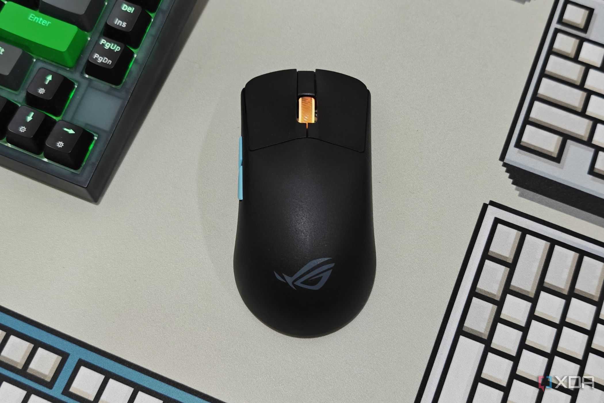 An image showing the ROG Harpe Ace Aim Lab Edition mouse kept on a deskmat.