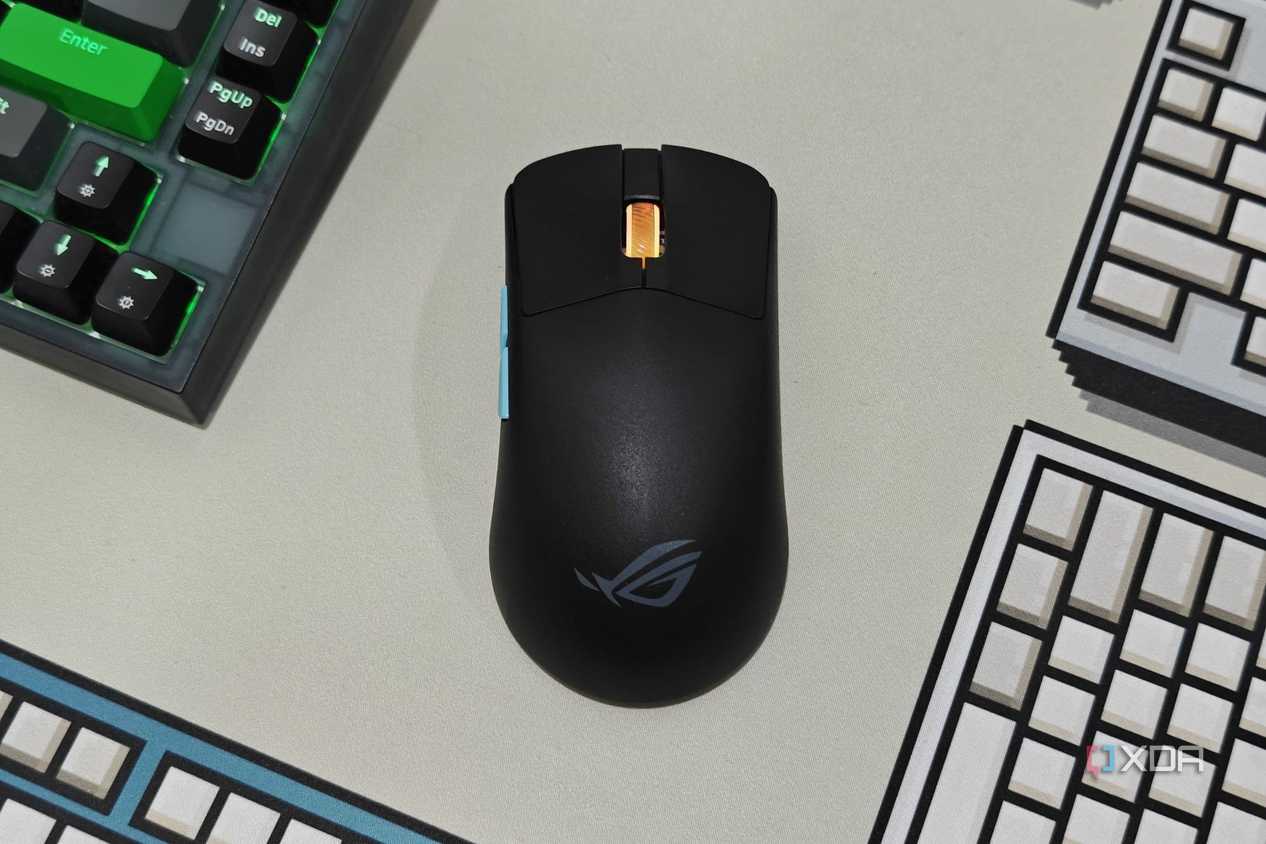 An image showing the ROG Harpe Ace Aim Lab Edition mouse kept on a deskmat.