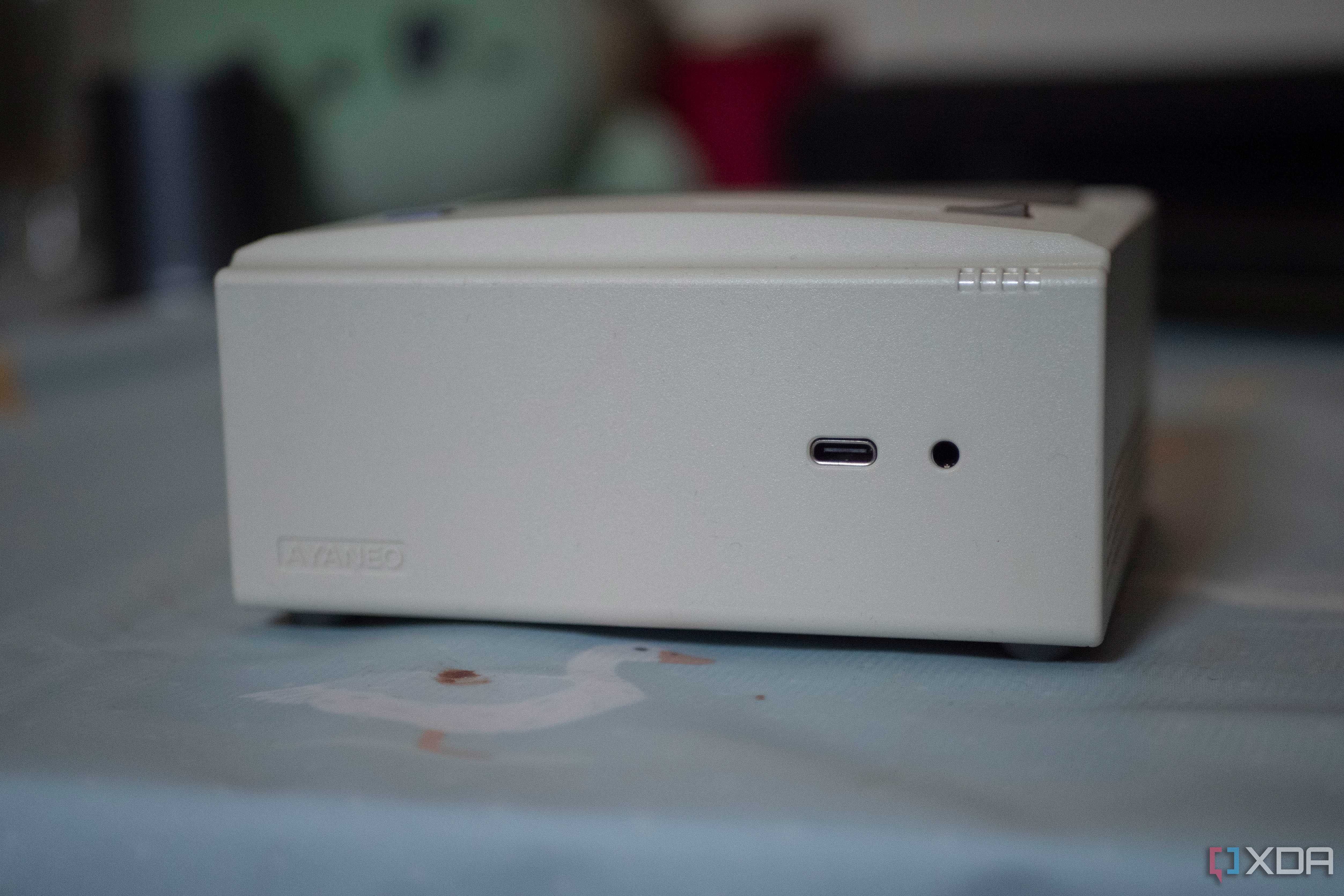 Ayaneo Retro Mini PC with USB-C port and headphone jack showing on a table