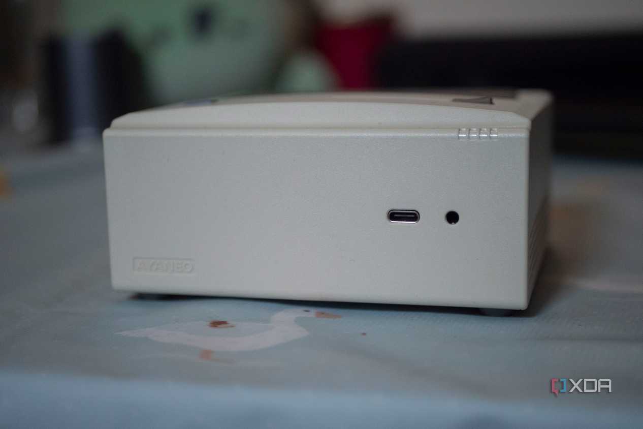 Ayaneo Retro Mini PC with USB-C port and headphone jack showing on a table