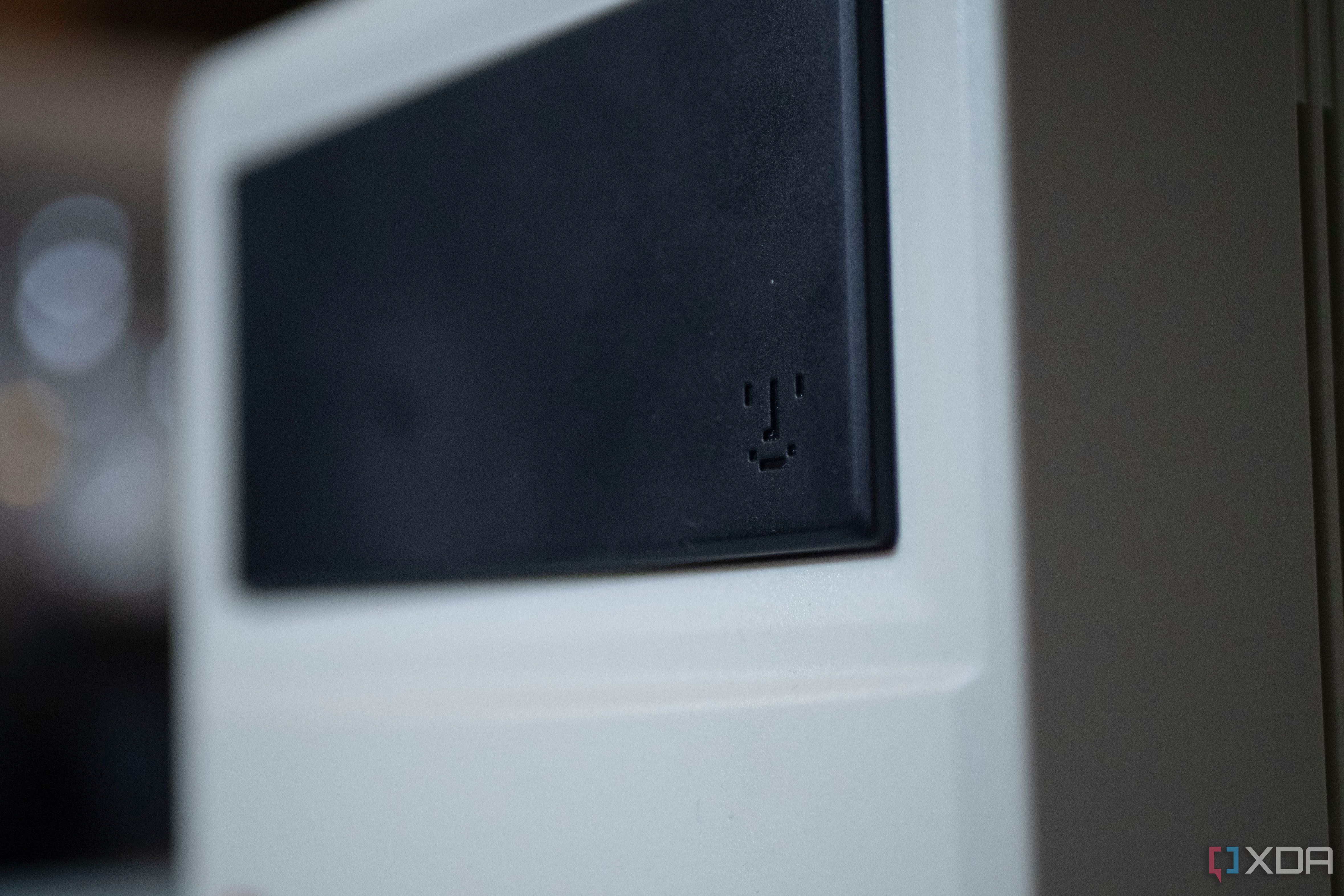 Smiley face from old Macintosh products on the front of the Ayaneo Retro Mini PC