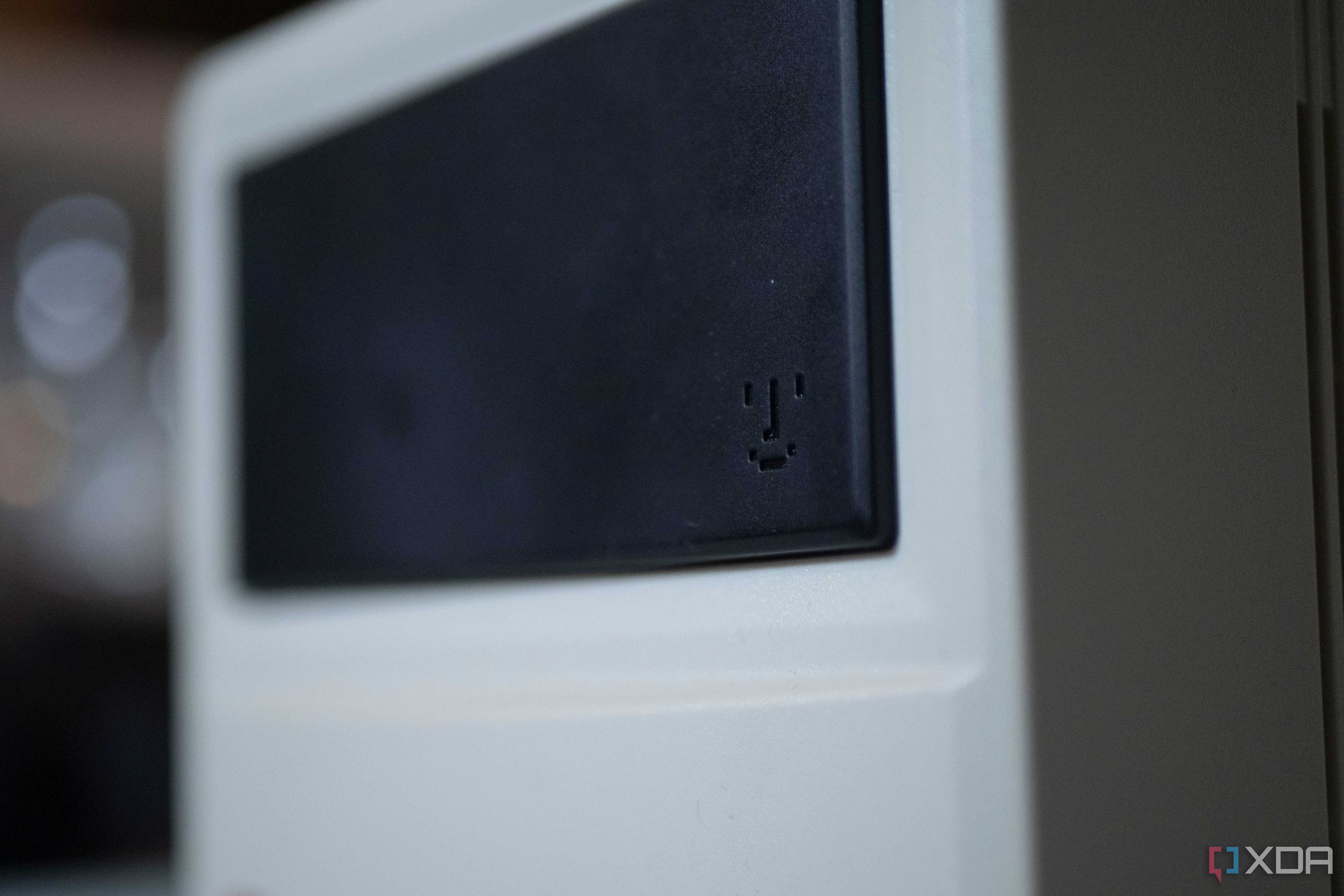 Smiley face from old Macintosh products on the front of the Ayaneo Retro Mini PC