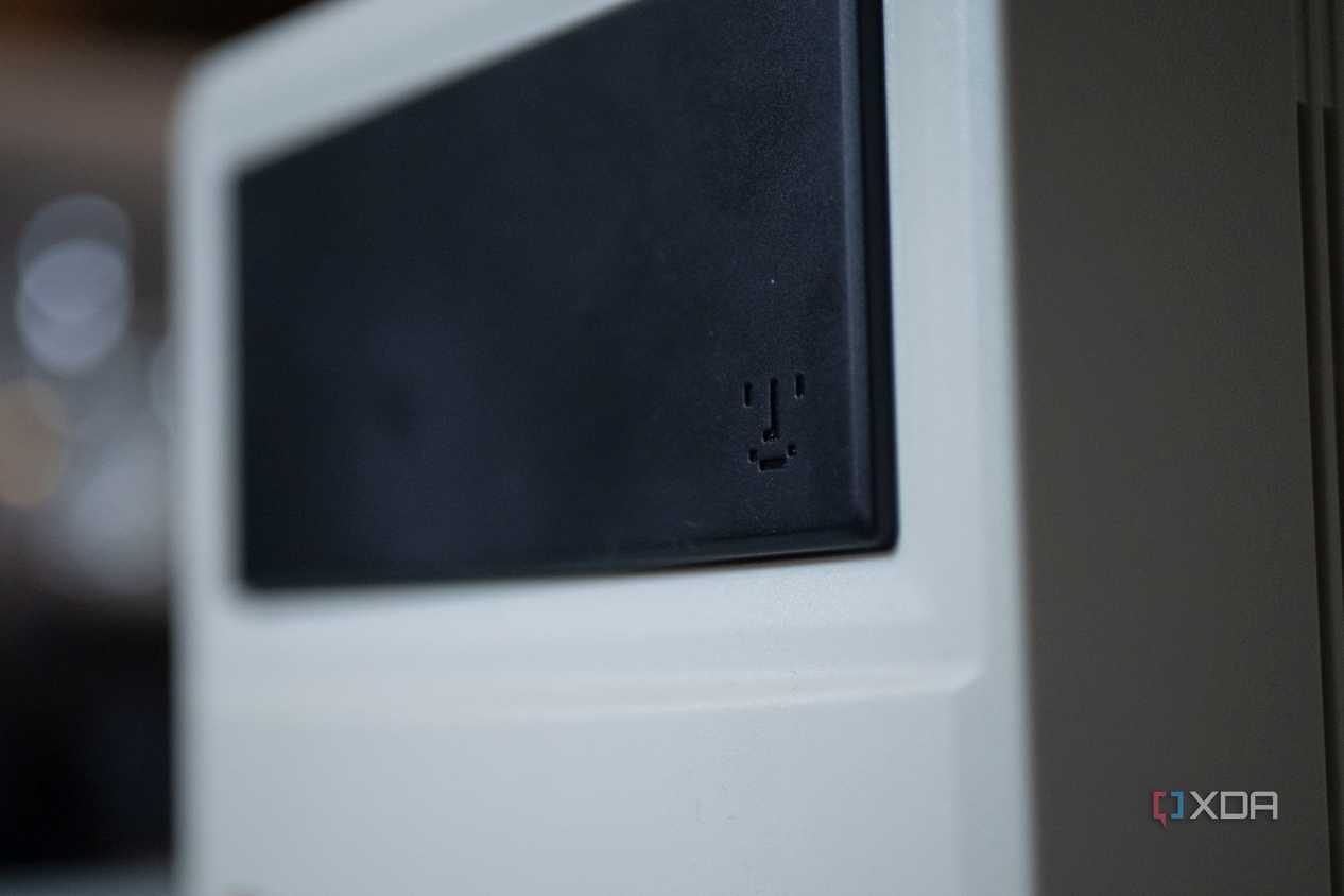 Smiley face from old Macintosh products on the front of the Ayaneo Retro Mini PC