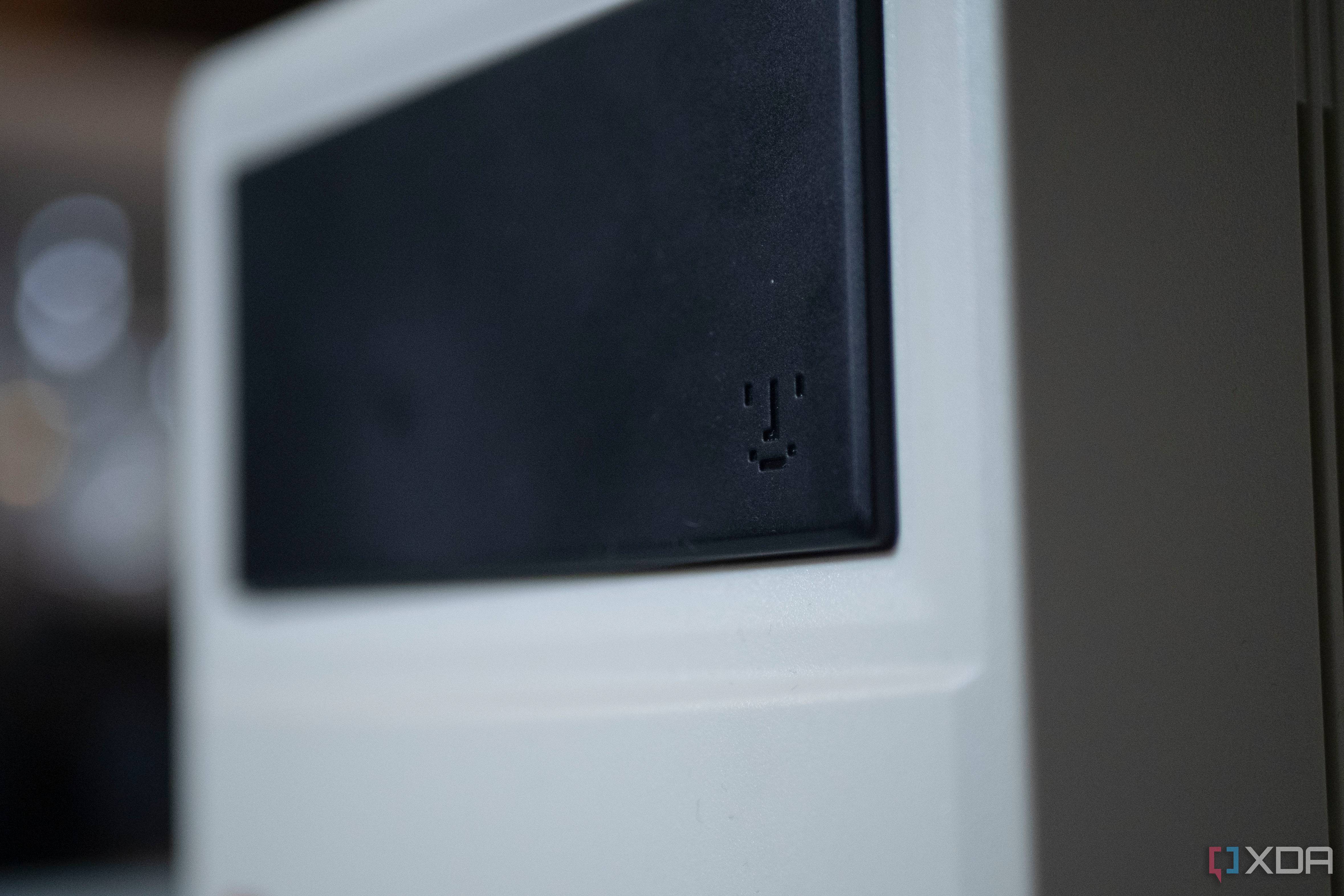 Smiley face from old Macintosh products on the front of the Ayaneo Retro Mini PC