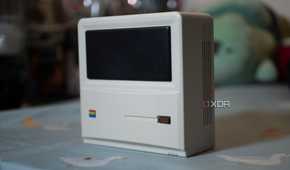 The front and side of the Ayaneo AM01 Retro Mini PC, standing upright on a table
