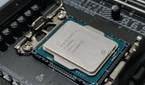 An image showing an Intel processor resting on a motherboard socket.