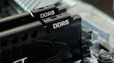 An image showing two DDR5 memory sticks installed on a motherboard