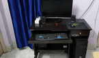 Black desktop PC setup with monitor and peripherals