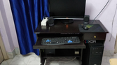 Black desktop PC setup with monitor and peripherals