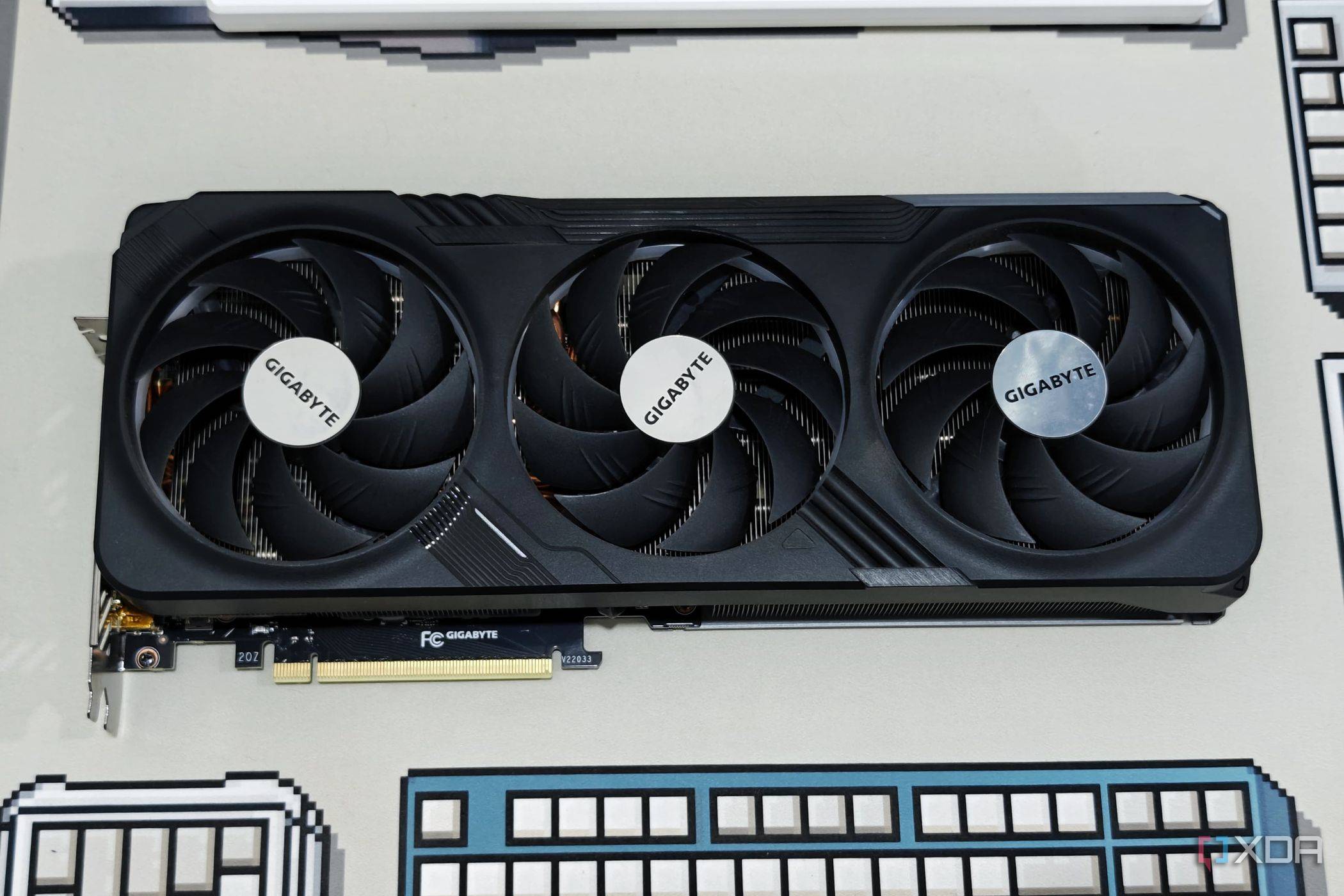 An image showing the Gigabyte GeForce RTX 4070 Ti Gaming OC GPU kept on a deskmat.