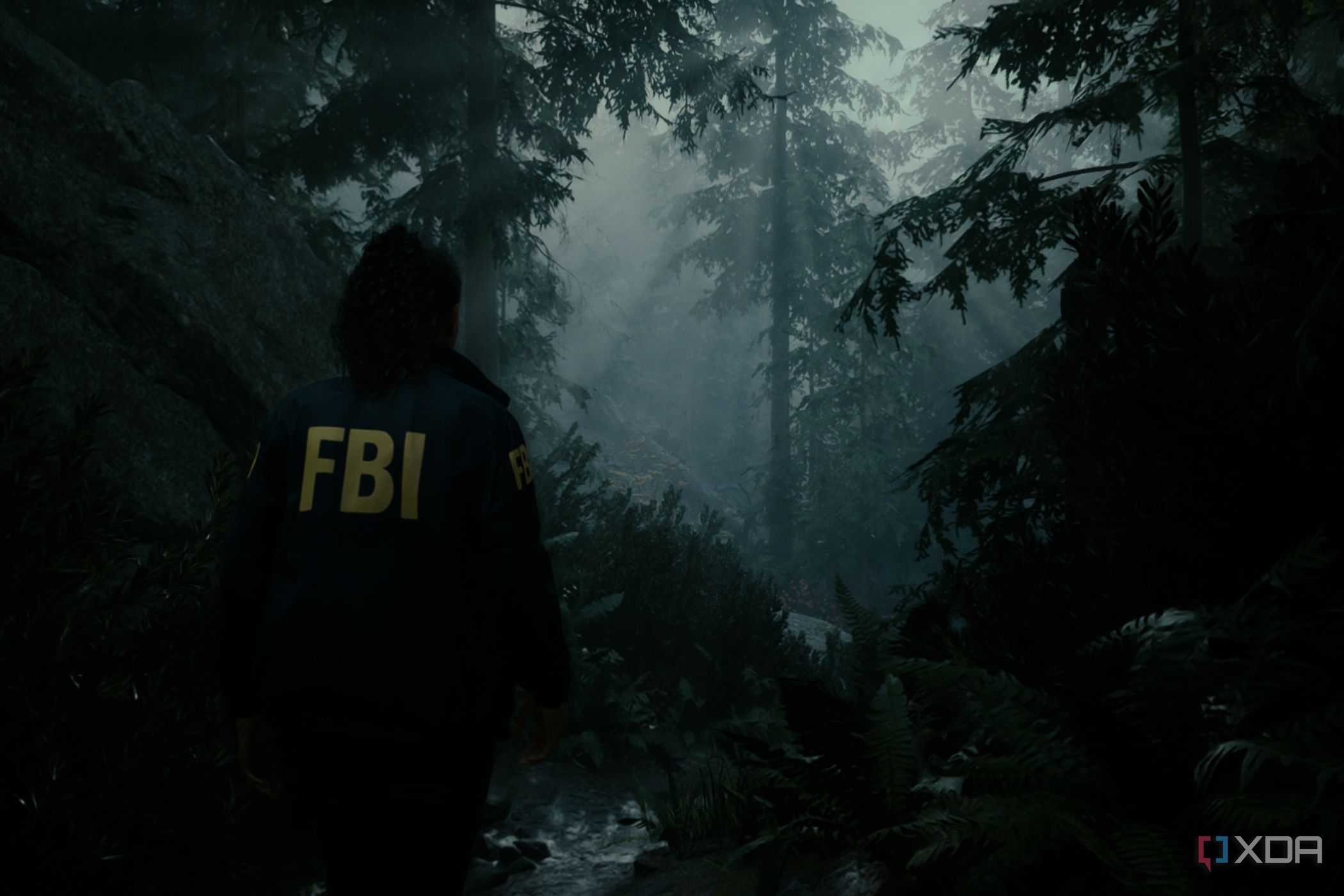 A screenshot showing "god rays" peeking through the trees in Alan Wake 2.