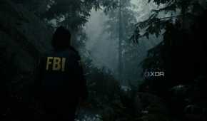 A screenshot showing "god rays" peeking through the trees in Alan Wake 2.