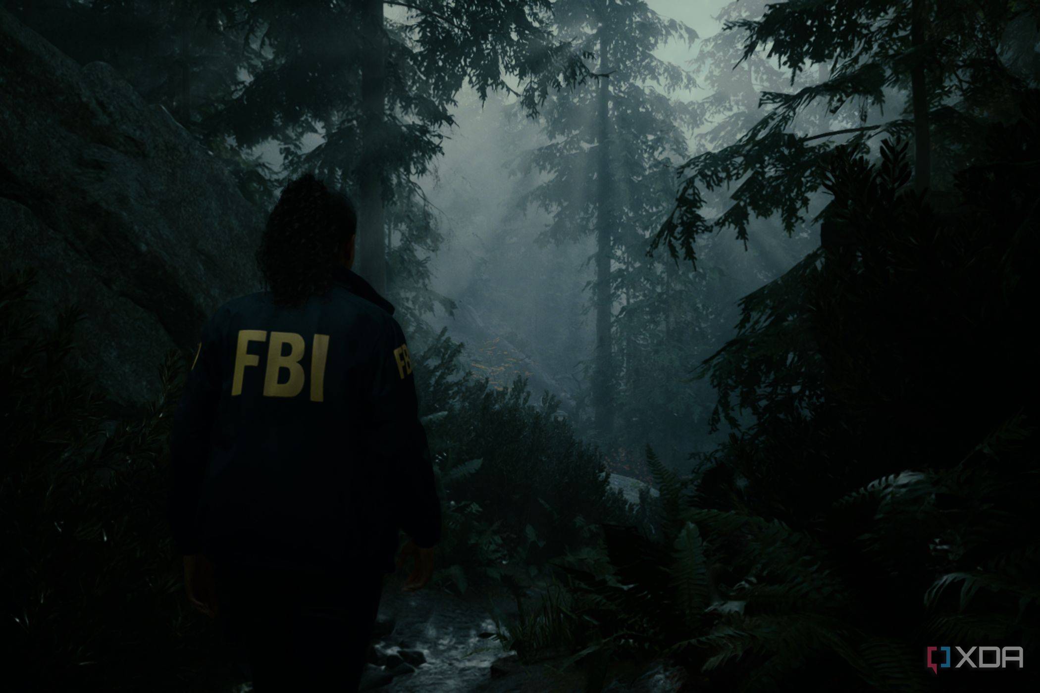 A screenshot showing "god rays" peeking through the trees in Alan Wake 2.