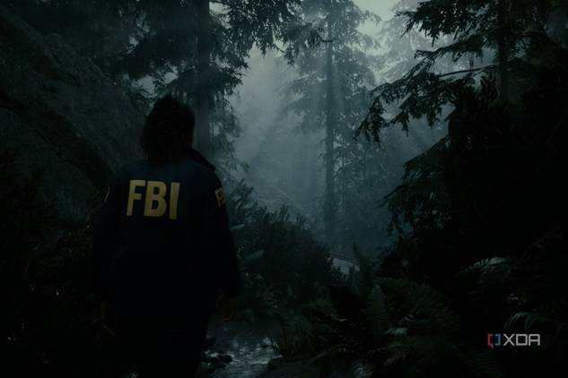 A screenshot showing "god rays" peeking through the trees in Alan Wake 2.