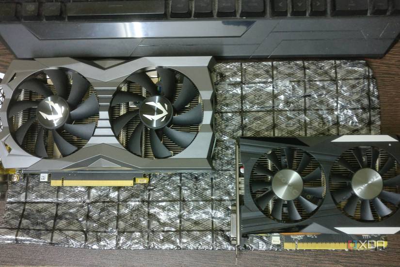 GTX 1660 Ti and GTX 1050 Ti graphics cards on a desk