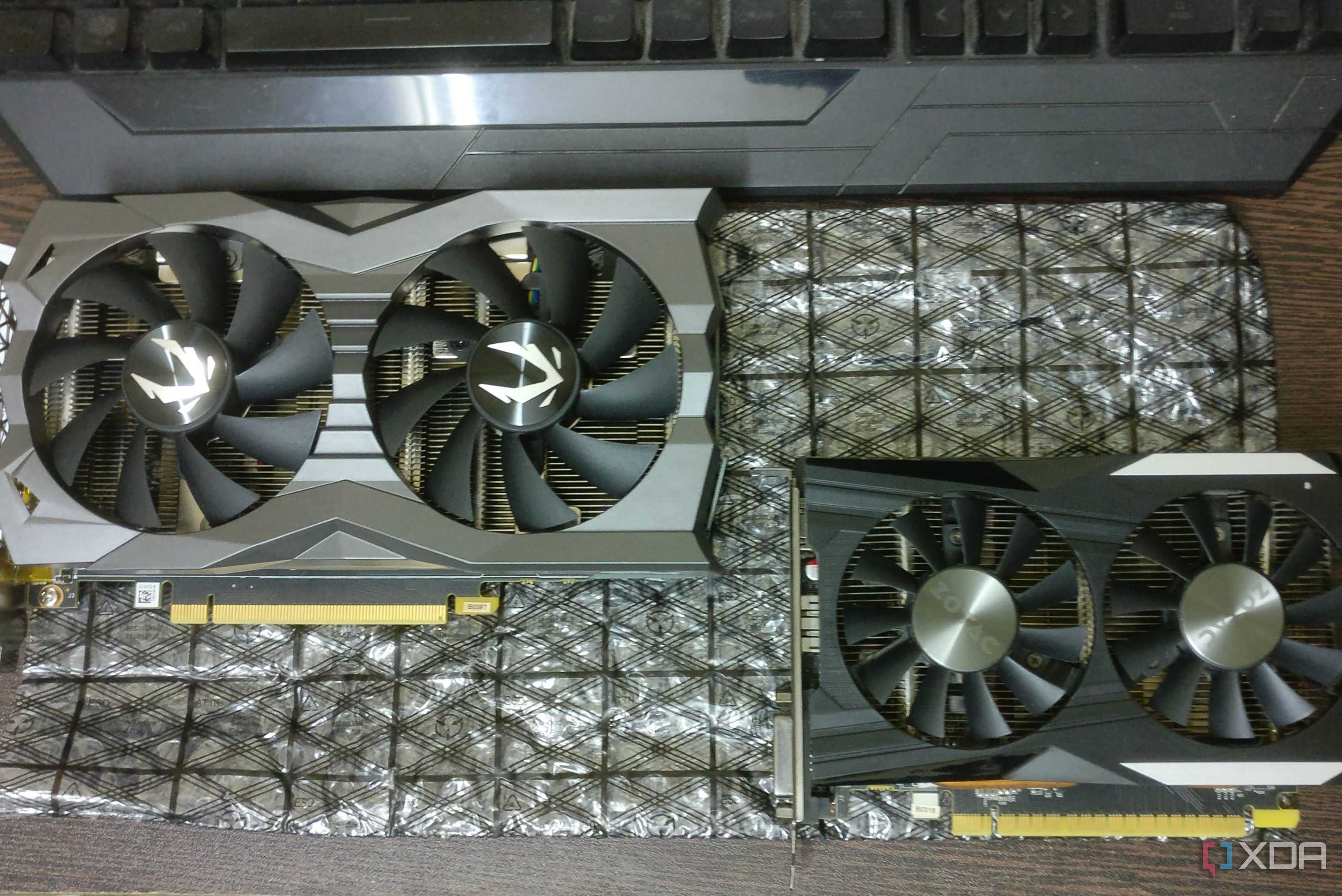 GTX 1660 Ti and GTX 1050 Ti graphics cards on a desk