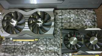 GTX 1660 Ti and GTX 1050 Ti graphics cards on a desk