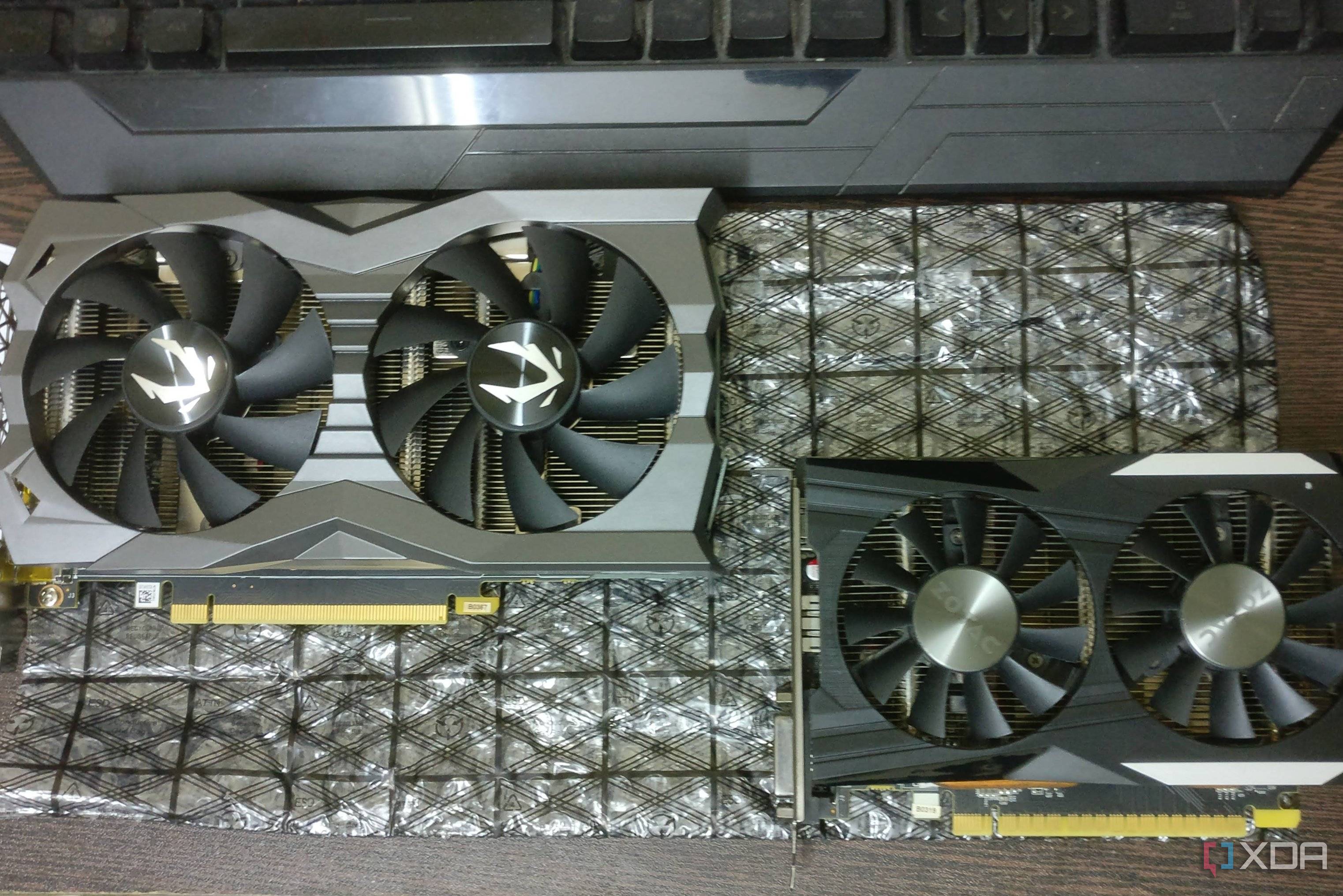 GTX 1660 Ti and GTX 1050 Ti graphics cards on a desk
