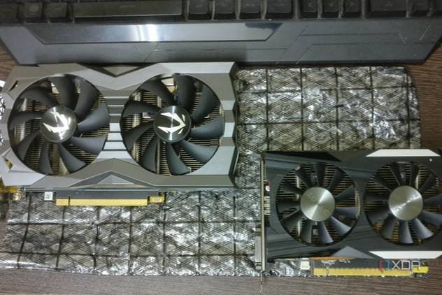 GTX 1660 Ti and GTX 1050 Ti graphics cards on a desk
