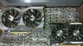 GTX 1660 Ti and GTX 1050 Ti graphics cards on a desk