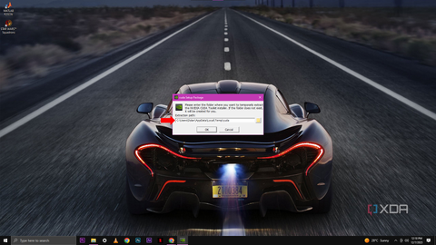A screenshot showing a popup window titled "cuda Setup Package" asking for a folder path to temporarily extract the NVIDIA CUDA Toolkit installer files, with the default path already filled in and a red arrow pointing to the OK button.