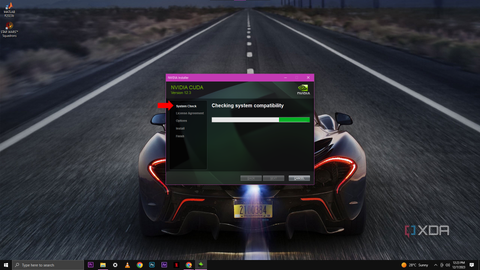 A screenshot of the NVIDIA Installer window conducting a "Checking system compatibility" system check.