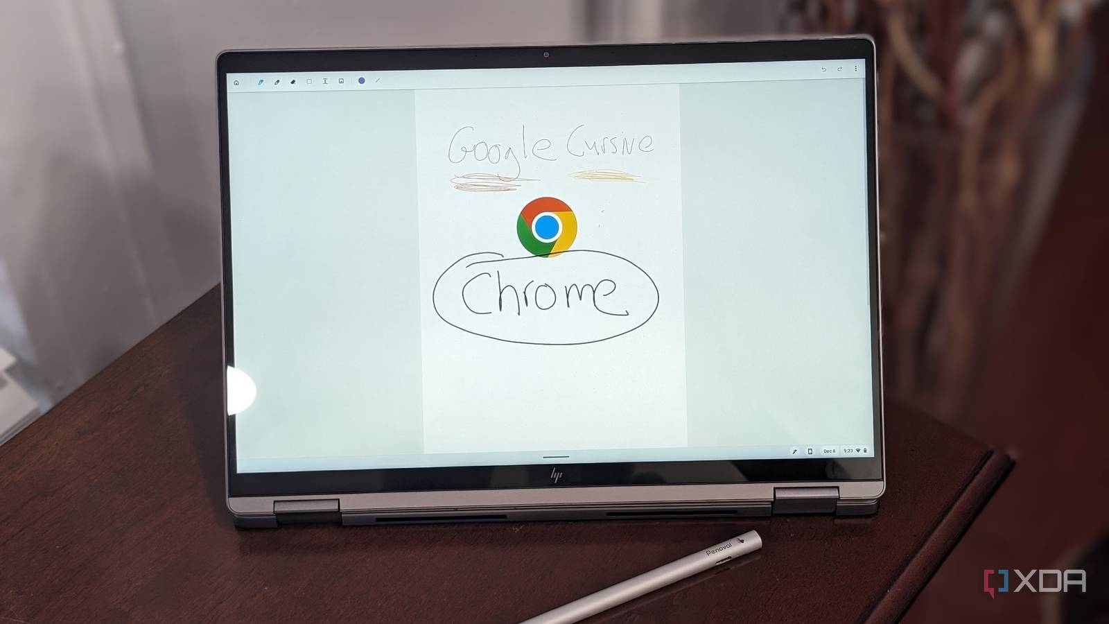 The display on the HP Chromebook Plus x360 Laptop 14ct showing the Chrome Logo with a USI pen in theforeground
